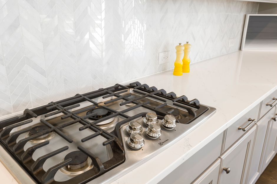 How to Deep Clean a Kitchen Oven and Stove Top Without Harsh Chemicals